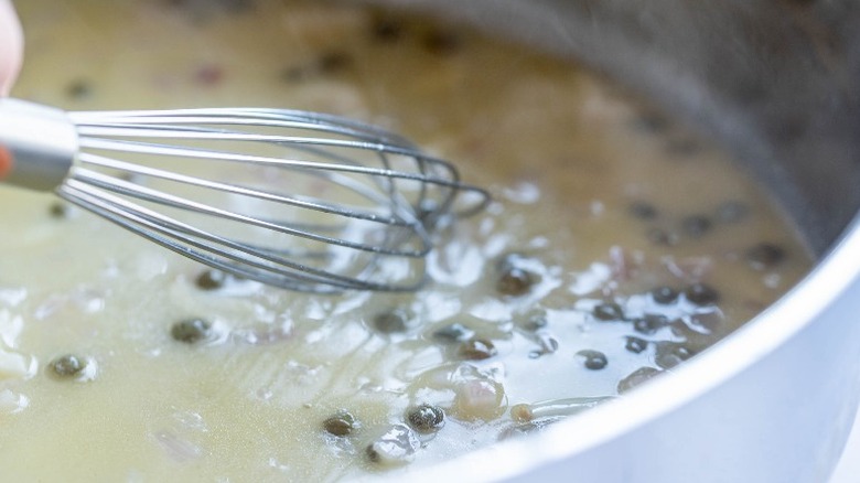 whisk in skillet with capers
