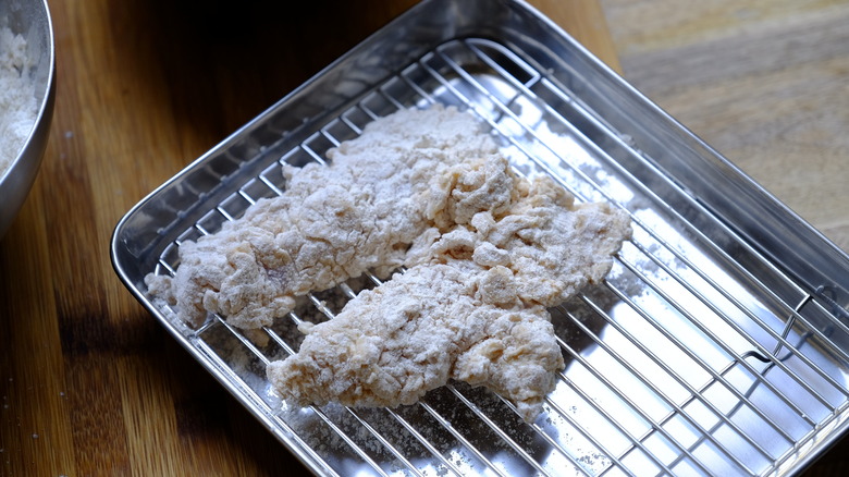 flour-coated raw chicken tenders