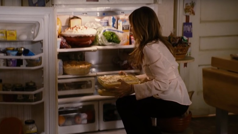 Sarah Jessica Parker holding cheese strata