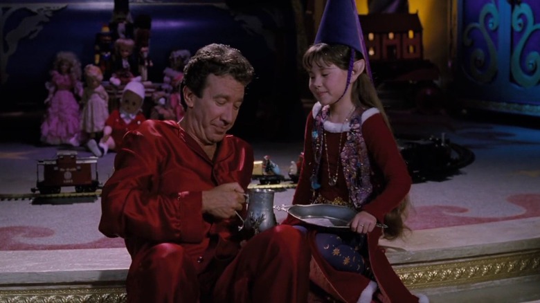 Judy giving Santa hot cocoa