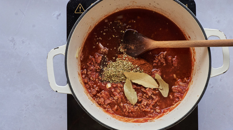 spices in pot of chili