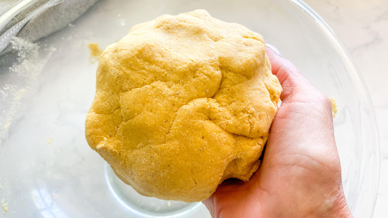 hand holding dough ball