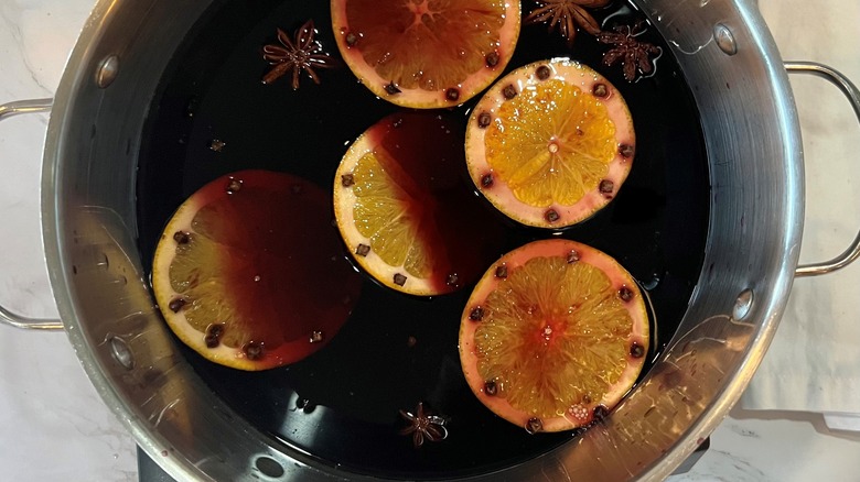 wine in pot with oranges and spices