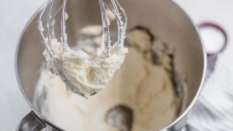 thick butter mixture on whisk