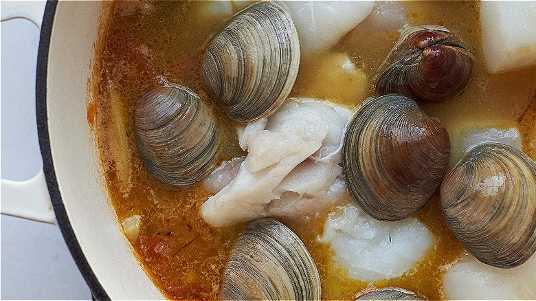 clam and fish in broth