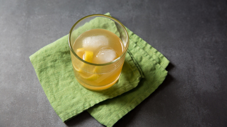 Gold rush cocktail on table