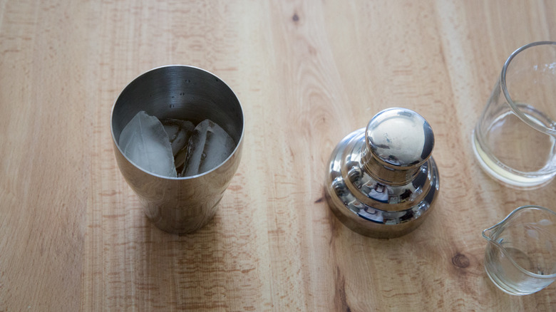 ice-filled cocktail shaker on table