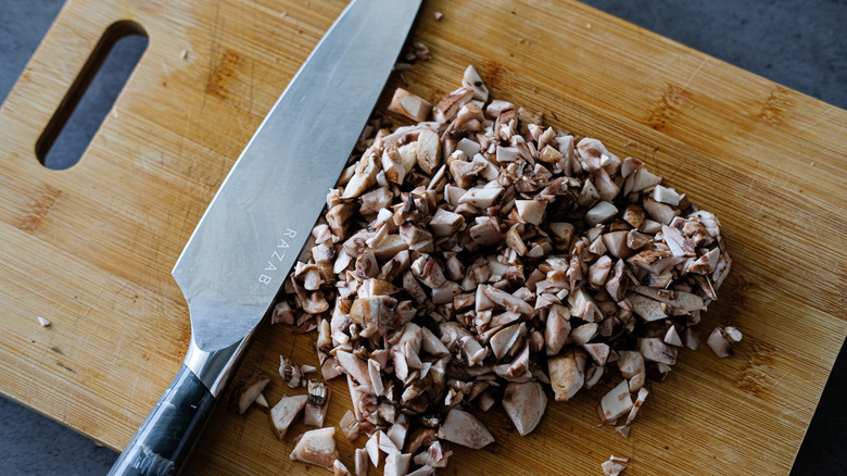 chopped mushrooms on cutting board