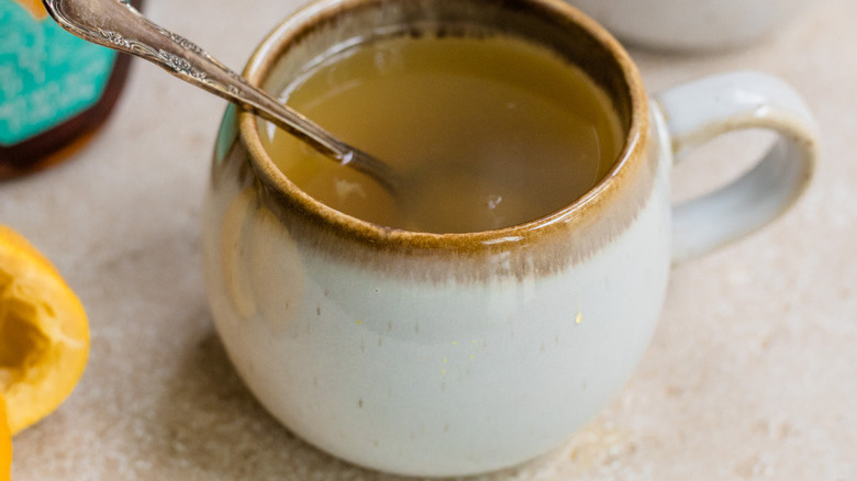 mug with drink and spoon