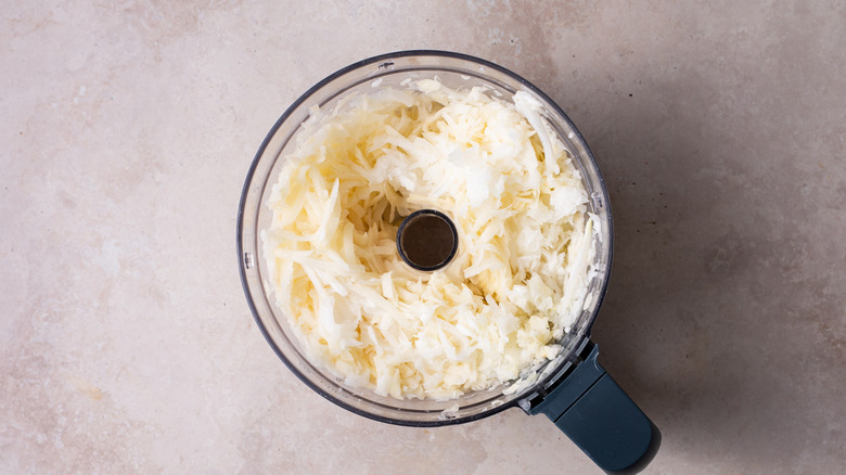 grated potatoes in a food processor