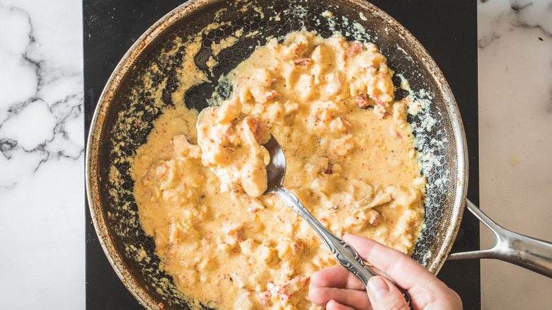 stirring lobster newburg filling