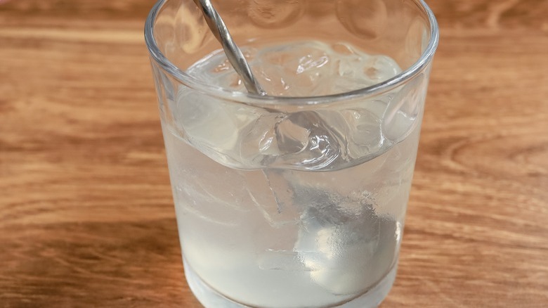 stirring martini in glass