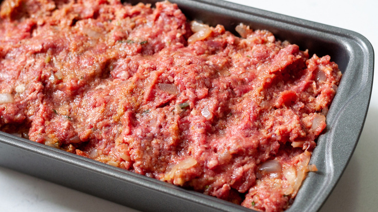 raw meatloaf in pan