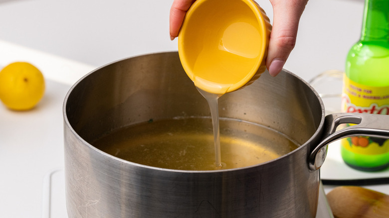 pouring liquid into pot