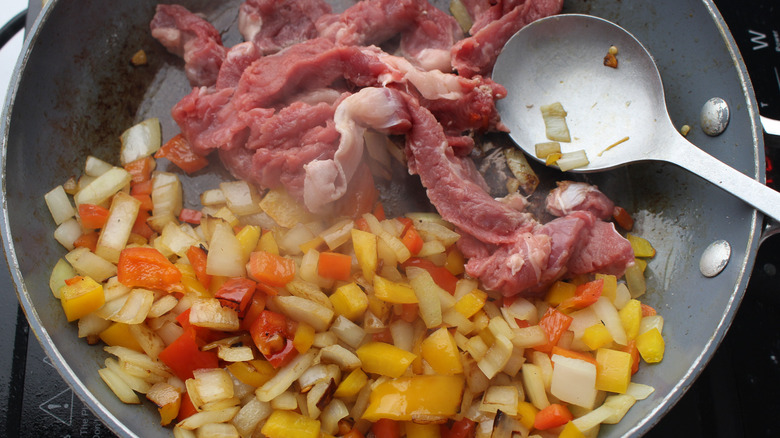 steak and veggies in skillet