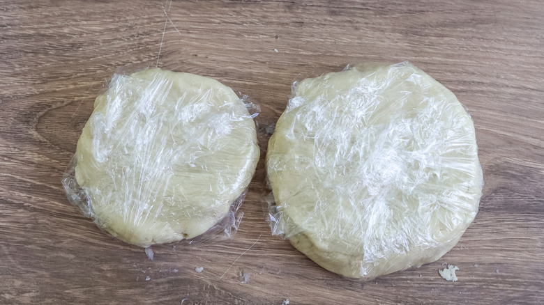 two dough discs in plastic