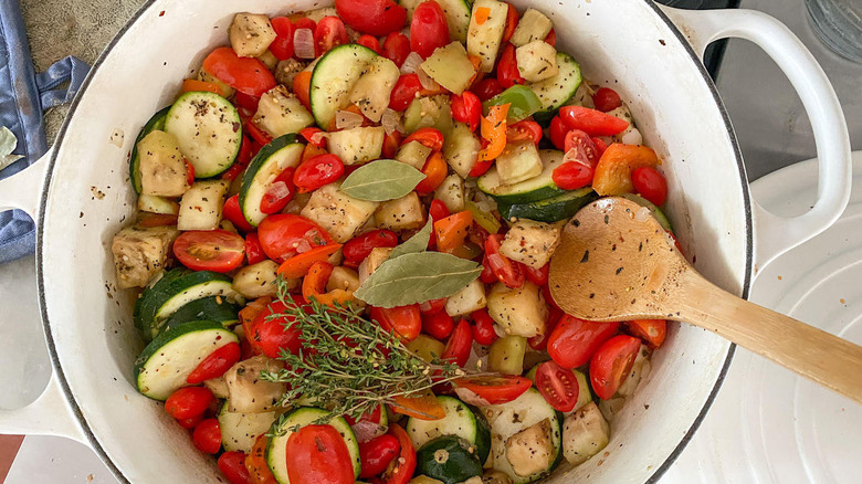 chopped vegetables in white pot