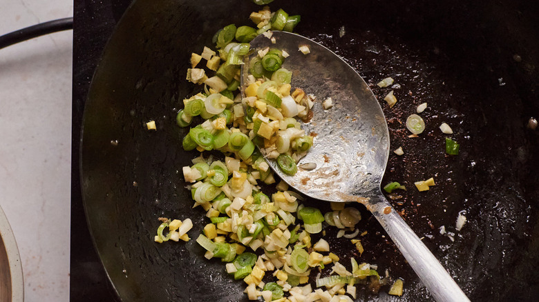 cooking vegetables in a wok