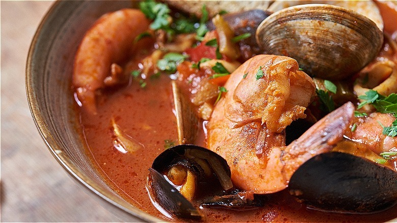 closeup of shrimp and mussels in broth