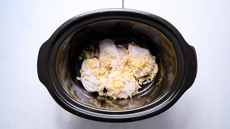 onion and chicken in slow cooker