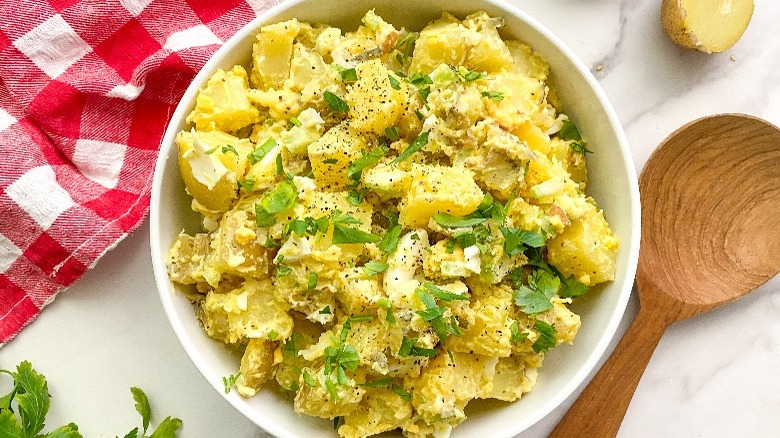 potato salad in white serving bowl