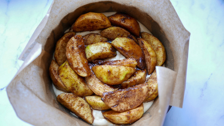 unbaked apple cake in pan