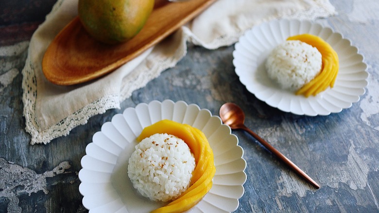 plates of rice and mango