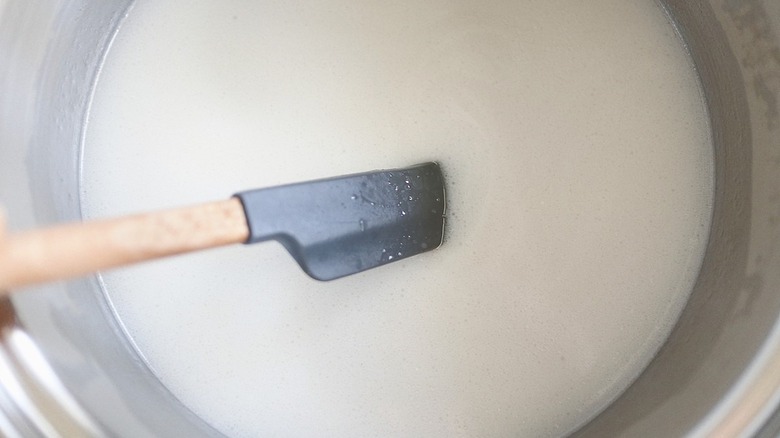 coconut sauce with rubber spatula