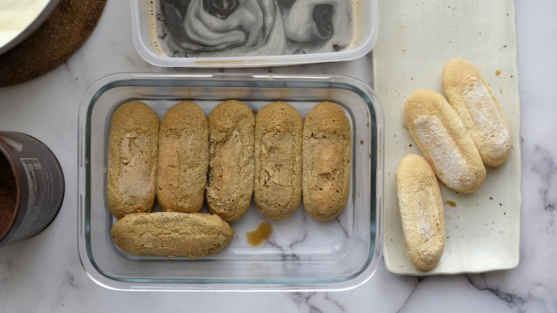 coffee-soaked ladyfingers in pan