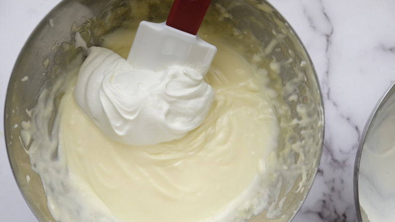 folding whipped cream into mascarpone