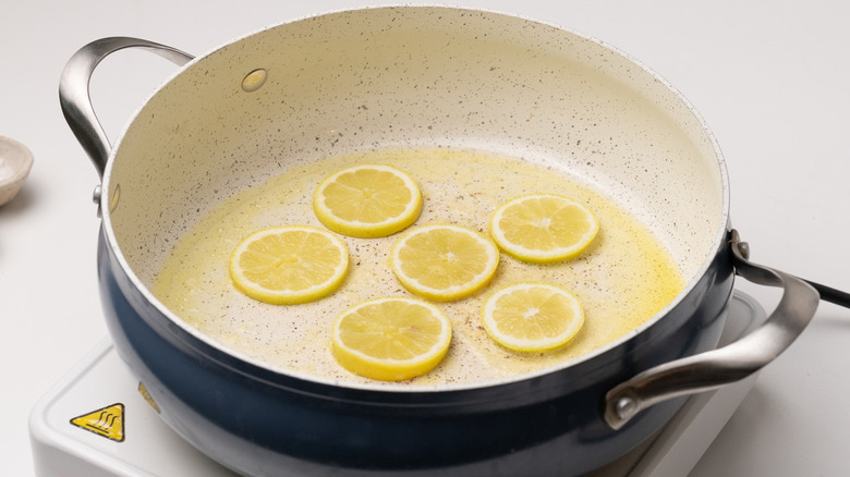 searing lemon in a pan