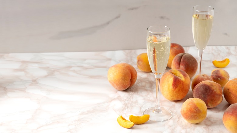 sparkling wine and peaches