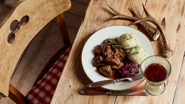 red wine and venison on plate