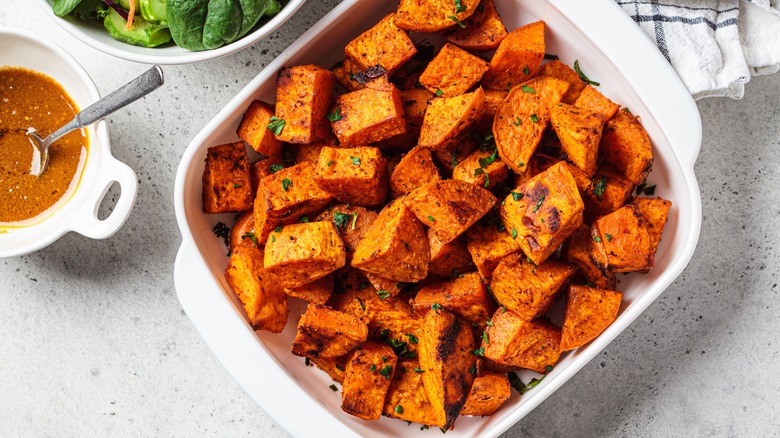 Roasted sweet potatoes in baking dish