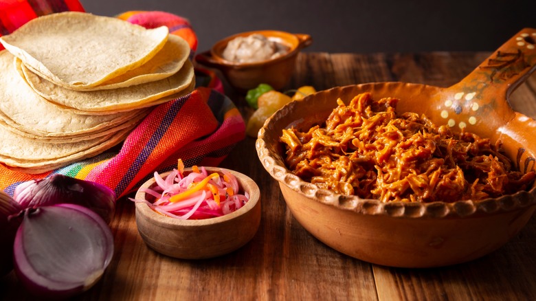 cochinita pibil served from a clay pot