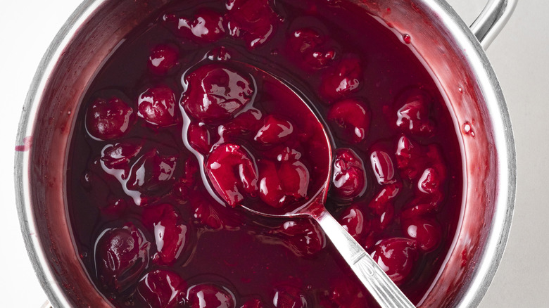 A spoon in cooking cherries