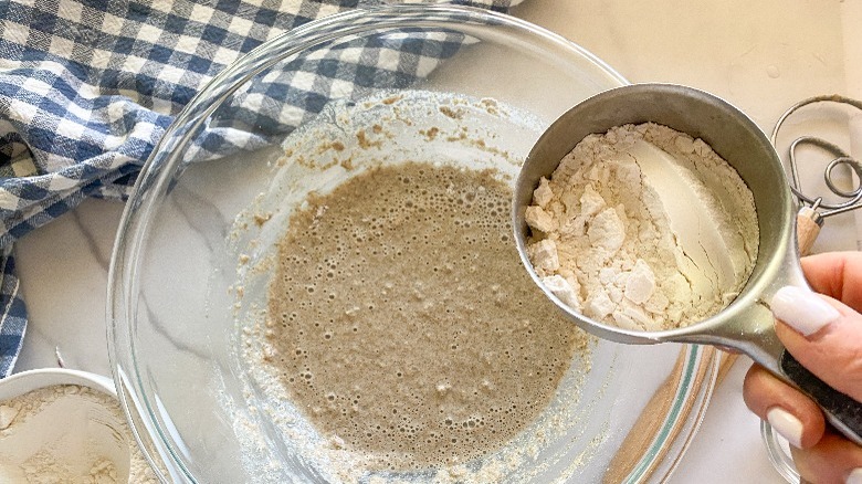 flour and dough mixture in glass bowl