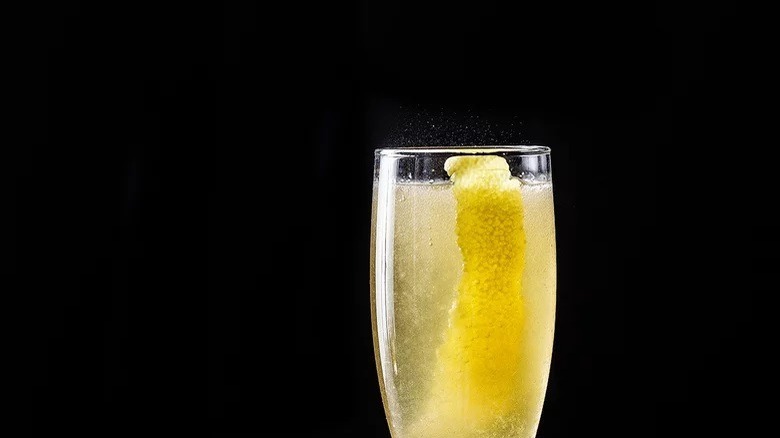 American 25 cocktail with lemon twists