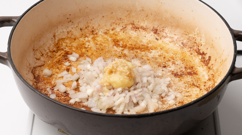 frying shallots, garlic and ginger in pan