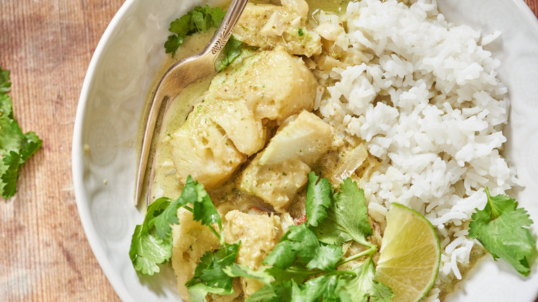 fish curry in a bowl with rice