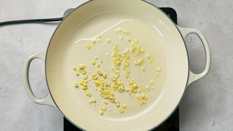 cooking garlic and ginger in skillet