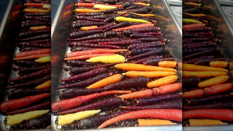 roasted carrots on coffee beans