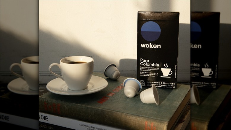 Cup of coffee with Woken pods