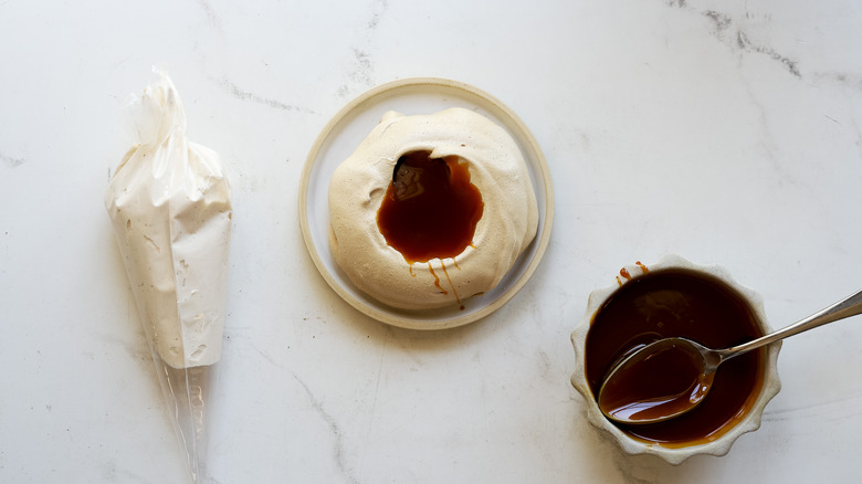 Caramel spooned on coffee meringue