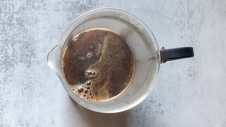 hot coffee in measuring cup