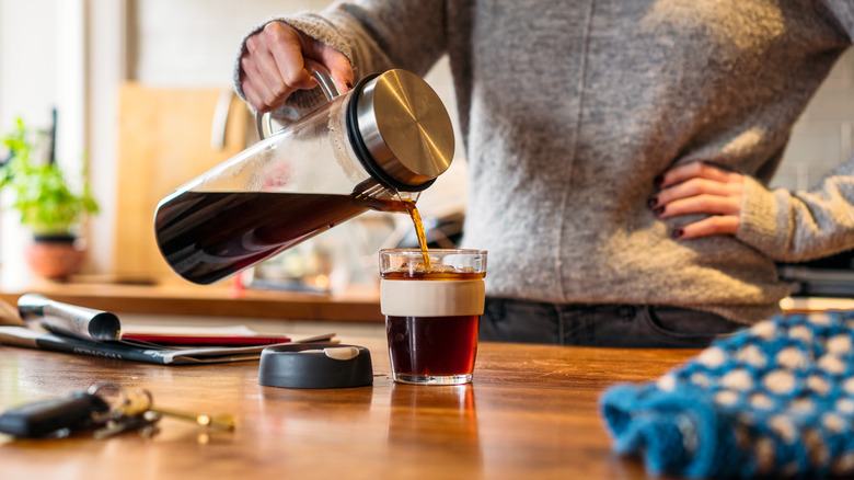 Pouring bold coffee in the kitchen