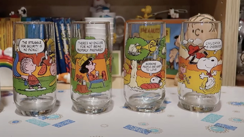 four Snoopy glasses