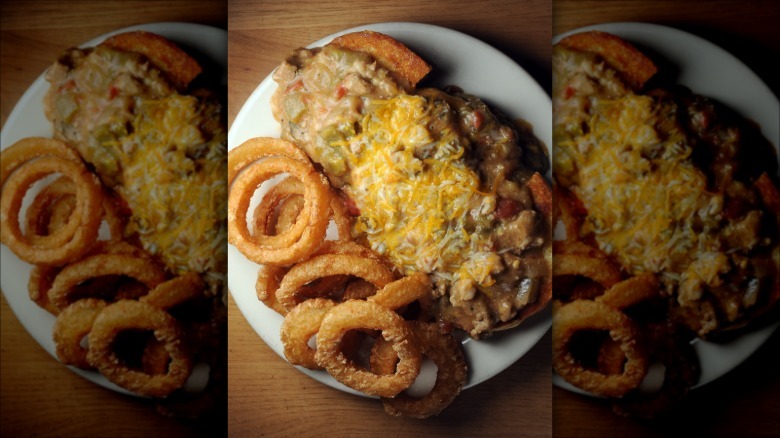 A slopper with onion rings on a plate