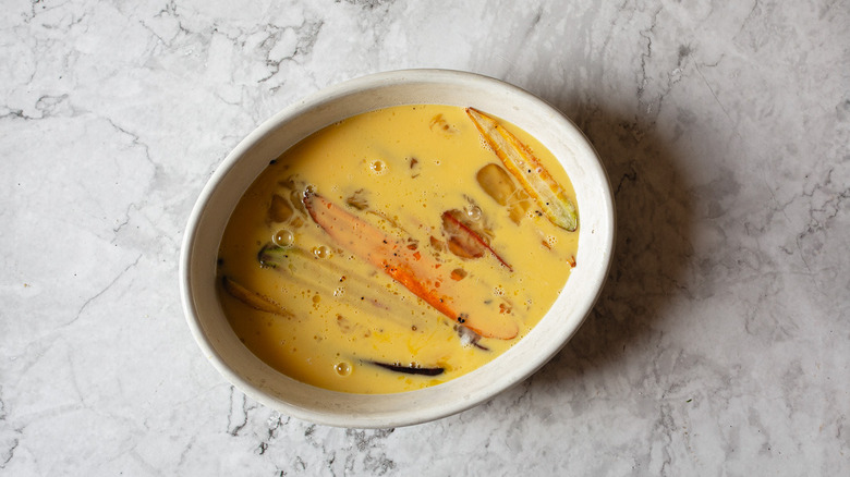 carrots in baking dish with egg mixture