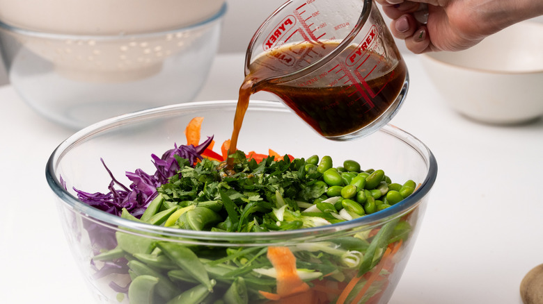 Preparing toasted sesame noodle salad